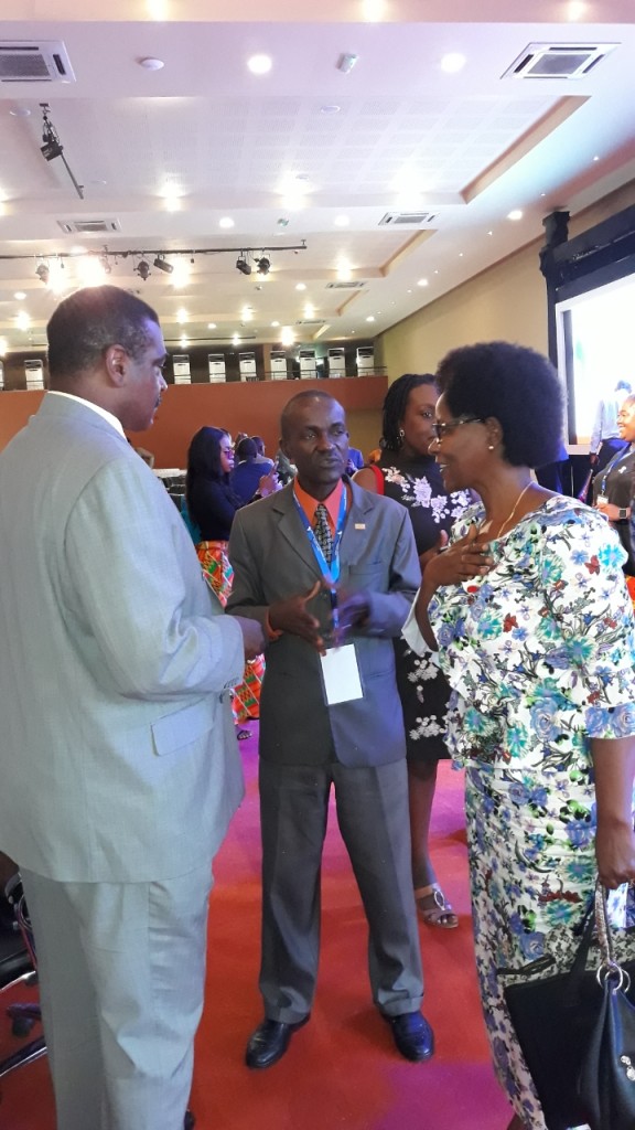 Angelo McClain speaks with conference attendees