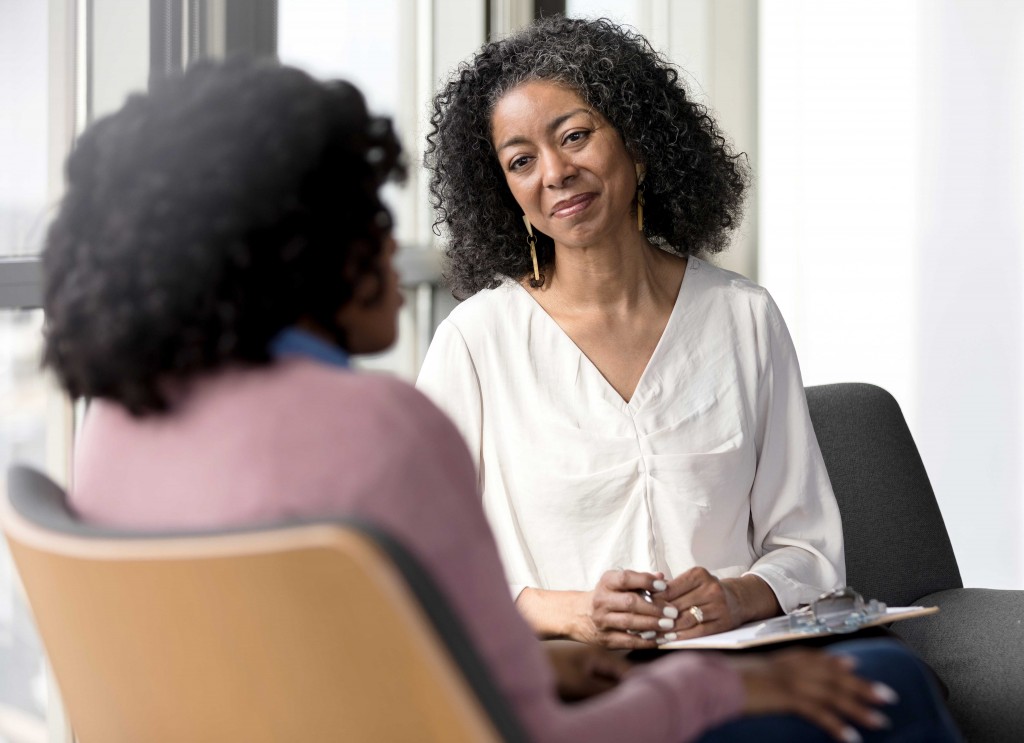 Social Worker Meeting With Female Client