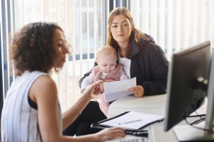 A child welfare social worker and clients.